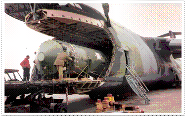 Figure 2: TOPAZ-II reactor in shipping container being loaded on a United States Air Force C-5 in St. Petersburg, Russia, April 1992.